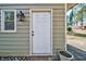 Exterior view of the house showcasing a white door and landscaping at 3700 Ashley Woods Dr, Powder Springs, GA 30127