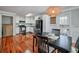 Modern kitchen with white cabinets, stainless steel appliances, and hardwood floors at 3700 Ashley Woods Dr, Powder Springs, GA 30127