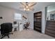 Home office with hardwood floors, built-in shelving and desk at 3700 Ashley Woods Dr, Powder Springs, GA 30127