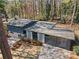 An aerial view of the property, showcasing the home's layout, carport, and surroundings at 3732 Summitridge Dr, Atlanta, GA 30340