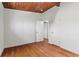 Bright bedroom with hardwood floors and white walls featuring wooden ceiling at 3732 Summitridge Dr, Atlanta, GA 30340