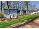 Inviting exterior of a two-story home with a well-maintained lawn and blue siding at 3732 Summitridge Dr, Atlanta, GA 30340