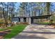 Charming exterior of a two-story home featuring a carport and manicured lawn at 3732 Summitridge Dr, Atlanta, GA 30340