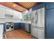 Bright kitchen with stainless steel refrigerator and blue and white cabinets at 3732 Summitridge Dr, Atlanta, GA 30340