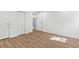 An airy room with wood floors and built-in closet at 3732 Summitridge Dr, Atlanta, GA 30340