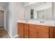 Bathroom with double vanity, light wood cabinets, and a large mirror at 4367 Favored Way, Union City, GA 30291