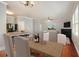 Dining area with hardwood floors, chandelier, and view of kitchen and living room at 4367 Favored Way, Union City, GA 30291