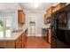 Kitchen with granite countertops, wooden cabinets, and access to laundry room at 4367 Favored Way, Union City, GA 30291