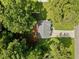 Aerial view of a house with a driveway and large backyard surrounded by trees at 45 Ashbury Ct, Dallas, GA 30157