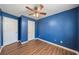 Blue bedroom with double closets and ceiling fan at 45 Ashbury Ct, Dallas, GA 30157