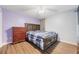 Spacious bedroom with wood-look floors and a large bed at 45 Ashbury Ct, Dallas, GA 30157