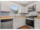 Kitchen with stainless steel appliances and wood cabinets at 45 Ashbury Ct, Dallas, GA 30157