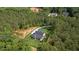 Aerial view of a house surrounded by lush greenery at 130 West Lake Blvd, Carrollton, GA 30116