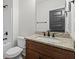 Charming bathroom featuring granite countertops, wood cabinets, and a shower-tub combo at 130 West Lake Blvd, Carrollton, GA 30116