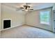 Spacious bedroom with neutral carpet and a large window overlooking the backyard, plus storage at 130 West Lake Blvd, Carrollton, GA 30116