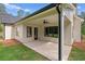 A covered patio featuring an outdoor ceiling fan and views of the lawn at 130 West Lake Blvd, Carrollton, GA 30116