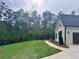 Well-manicured front yard with lush lawn and professional landscaping, enhancing curb appeal at 130 West Lake Blvd, Carrollton, GA 30116