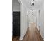 Bright hallway with wood floors, white walls, and stylish light fixtures at 130 West Lake Blvd, Carrollton, GA 30116