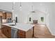 Bright kitchen featuring stainless steel appliances and bar stool seating at 130 West Lake Blvd, Carrollton, GA 30116