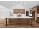 Modern kitchen island featuring bar stool seating and stainless steel appliances at 130 West Lake Blvd, Carrollton, GA 30116