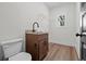 Cozy laundry room with a sink, granite countertop, and plenty of room to move around at 130 West Lake Blvd, Carrollton, GA 30116