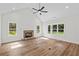 Spacious living room with a fireplace and plenty of natural light at 130 West Lake Blvd, Carrollton, GA 30116