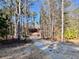 Gravel driveway leading to a wooded lot at 130 West Lake Blvd, Carrollton, GA 30116