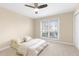 Bedroom with a large window and a ceiling fan, offering natural light and ventilation at 2657 Lenox Ne Rd # A-9, Atlanta, GA 30324