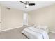 Spacious bedroom with a ceiling fan, plush carpet, and a door to another room at 2657 Lenox Ne Rd # A-9, Atlanta, GA 30324