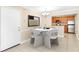 Dining area with a round table, seating for four, and a view into the kitchen at 2657 Lenox Ne Rd # A-9, Atlanta, GA 30324