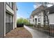 Condominium exterior featuring walkways, shrubbery, and gray and beige facades at 2657 Lenox Ne Rd # A-9, Atlanta, GA 30324