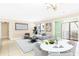Bright living room with a dining table, neutral tones, and a sliding glass door to a balcony at 2657 Lenox Ne Rd # A-9, Atlanta, GA 30324