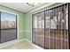 Green enclosed patio with vertical blinds and a view of the building at 2657 Lenox Ne Rd # A-9, Atlanta, GA 30324