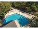 Aerial view of a pristine community pool with ample lounge seating and shaded areas at 2657 Lenox Ne Rd # A-9, Atlanta, GA 30324
