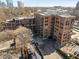 Aerial view of a brick apartment complex with surrounding trees and parking at 3235 Roswell Ne Rd # 617, Atlanta, GA 30305