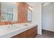 Stylish bathroom with double vanity, quartz countertops, and brick accent wall at 3235 Roswell Ne Rd # 617, Atlanta, GA 30305