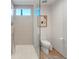 Well lit bathroom with glass shower door and neutral color palette at 3235 Roswell Ne Rd # 617, Atlanta, GA 30305