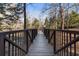Wooden bridge surrounded by trees and foliage at 3235 Roswell Ne Rd # 617, Atlanta, GA 30305