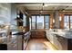 Modern kitchen featuring stainless steel appliances, granite countertops, and exposed brick accents at 3235 Roswell Ne Rd # 617, Atlanta, GA 30305