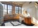 Bright home office with exposed brick, large windows, modern desk and stylish decor with lots of natural light at 3235 Roswell Ne Rd # 617, Atlanta, GA 30305