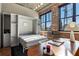 Modern office with a pullout bed, exposed brick, built-in shelves, large windows and contemporary decor at 3235 Roswell Ne Rd # 617, Atlanta, GA 30305