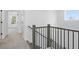 Upstairs hallway with carpet and modern railing at 3252 Durston Ct, Dacula, GA 30019