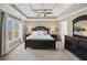 Bedroom featuring a trey ceiling, ceiling fan, large window and neutral walls at 4130 Summit Gate Dr, Suwanee, GA 30024