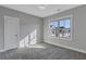 Bright bedroom with carpet flooring and large window at 972 Memorial Se Walk, Atlanta, GA 30316