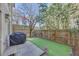 Private backyard with artificial turf and grill at 1213 Van Allen Nw Mews # 47, Atlanta, GA 30318