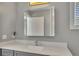 Modern bathroom with gray vanity, updated fixtures, and a large mirror at 1213 Van Allen Nw Mews # 47, Atlanta, GA 30318