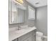 Modern bathroom with gray vanity, updated fixtures, and a large mirror at 1213 Van Allen Nw Mews # 47, Atlanta, GA 30318