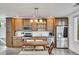 Modern kitchen with stainless steel appliances and wooden cabinets at 1213 Van Allen Nw Mews # 47, Atlanta, GA 30318