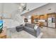 Open concept living space with L-shaped sofa, modern kitchen, and high ceilings at 1213 Van Allen Nw Mews # 47, Atlanta, GA 30318