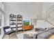 Modern living room with sectional sofa and built-in shelving at 1213 Van Allen Nw Mews # 47, Atlanta, GA 30318